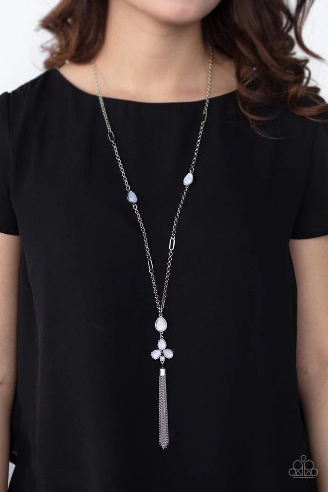 Paparazzi Accessories Eden Dew - White A cluster of dewy white teardrop beads coalesces at the bottom of a lengthened silver chain. Matching beads embedded in airy silver frames dot the chains that climb the chest, bringing an extra pop of color to the wh