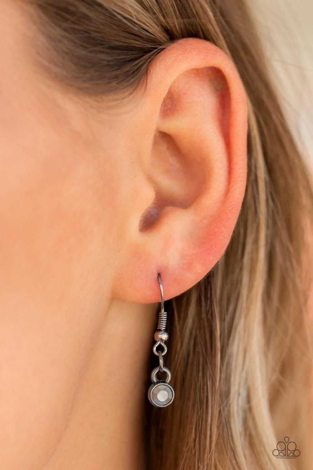 Paparazzi Accessories Bada BLING Bada Boom - Black Featuring a regal emerald style cut, a faceted hematite rhinestone is pressed into the center of a glistening gunmetal frame bordered by dainty hematite rhinestones. The dramatic pendant swings from the b
