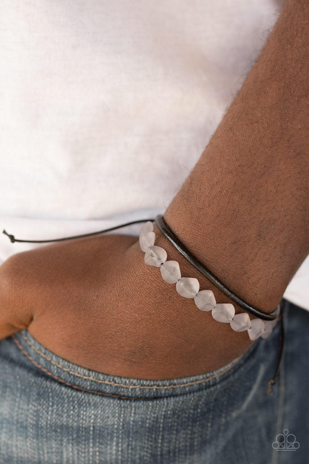 Paparazzi Accessories Treasure Trail ~Silver Featuring an opaque finish, a strand of faceted gray beads and a strand of shiny leather cording wrap around the wrist, creating dainty layers. Features an adjustable sliding knot closure. Sold as one individua