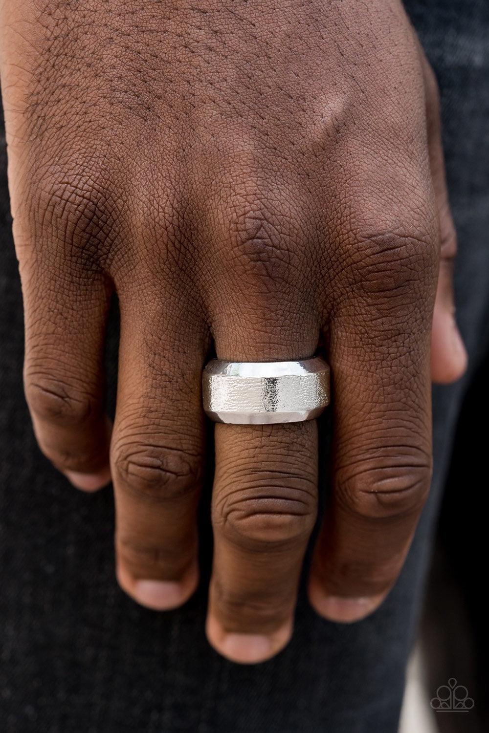 Paparazzi Accessories Checkmate - Silver The center of a beveled silver band has been delicately hammered in shimmery detail for a metro inspired look. Features a stretchy band for a flexible fit. Jewelry