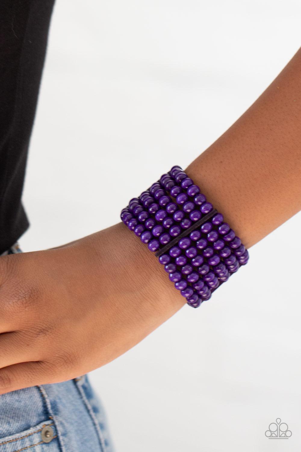 Paparazzi Accessories Tanning in Tanzania - Purple Held together with rectangular wooden fittings, strands of vivacious purple wooden beads are threaded along stretchy bands that layer around the wrist into one colorful stretch bracelet Sold as one indivi