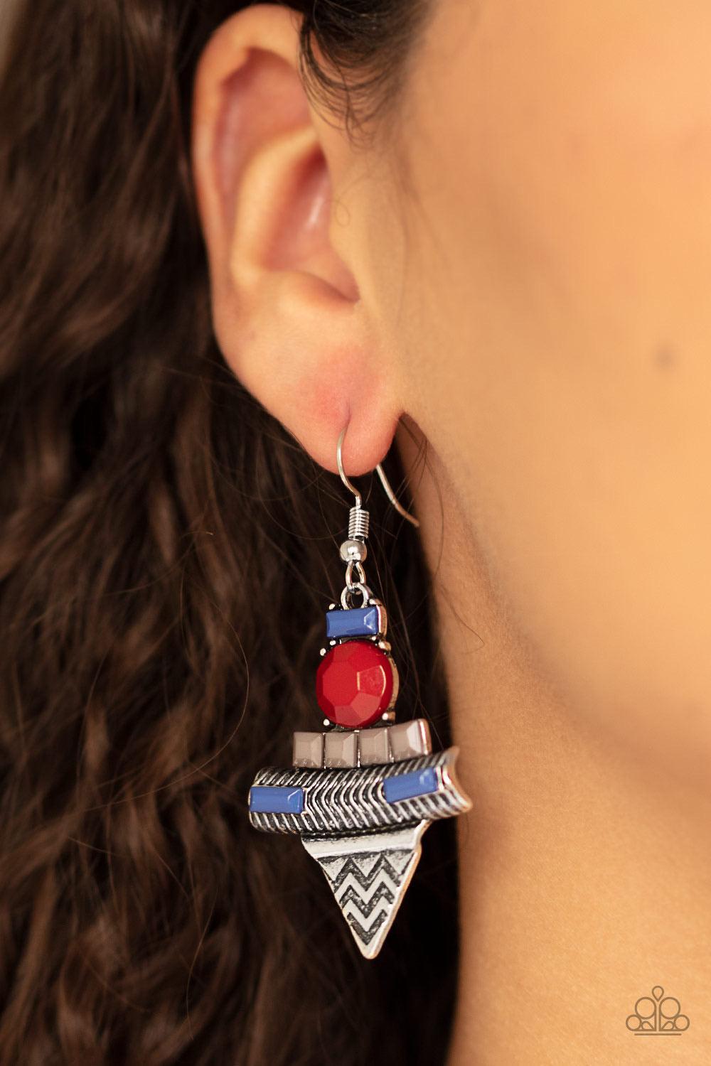 Paparazzi Accessories Tribal Terrain ~Multi Featuring an array of blue, gray, and wine beading, a geometric silver frame swings from the ear for a colorful tribal look. Earring attaches to a standard fishhook fitting. Sold as one pair of earrings.