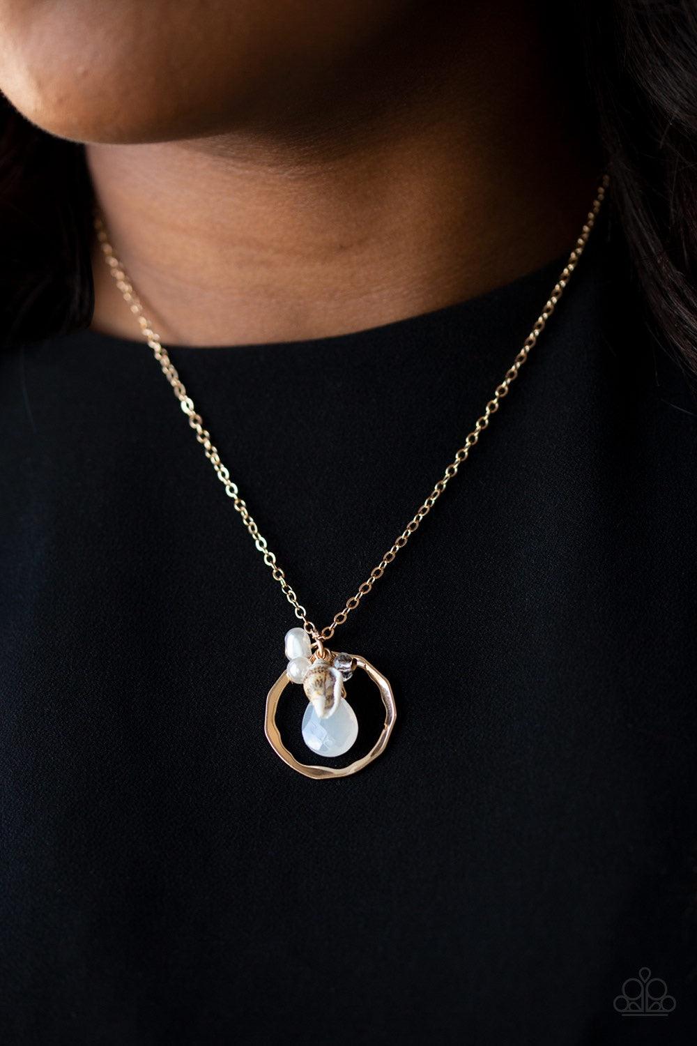 Paparazzi Accessories Coastal Couture - Gold A dainty shell, white crystal-like bead, opaque teardrop, and pearly white beads swing from the bottom of a hammered gold hoop, creating a whimsically clustered pendant below the collar. Features an adjustable