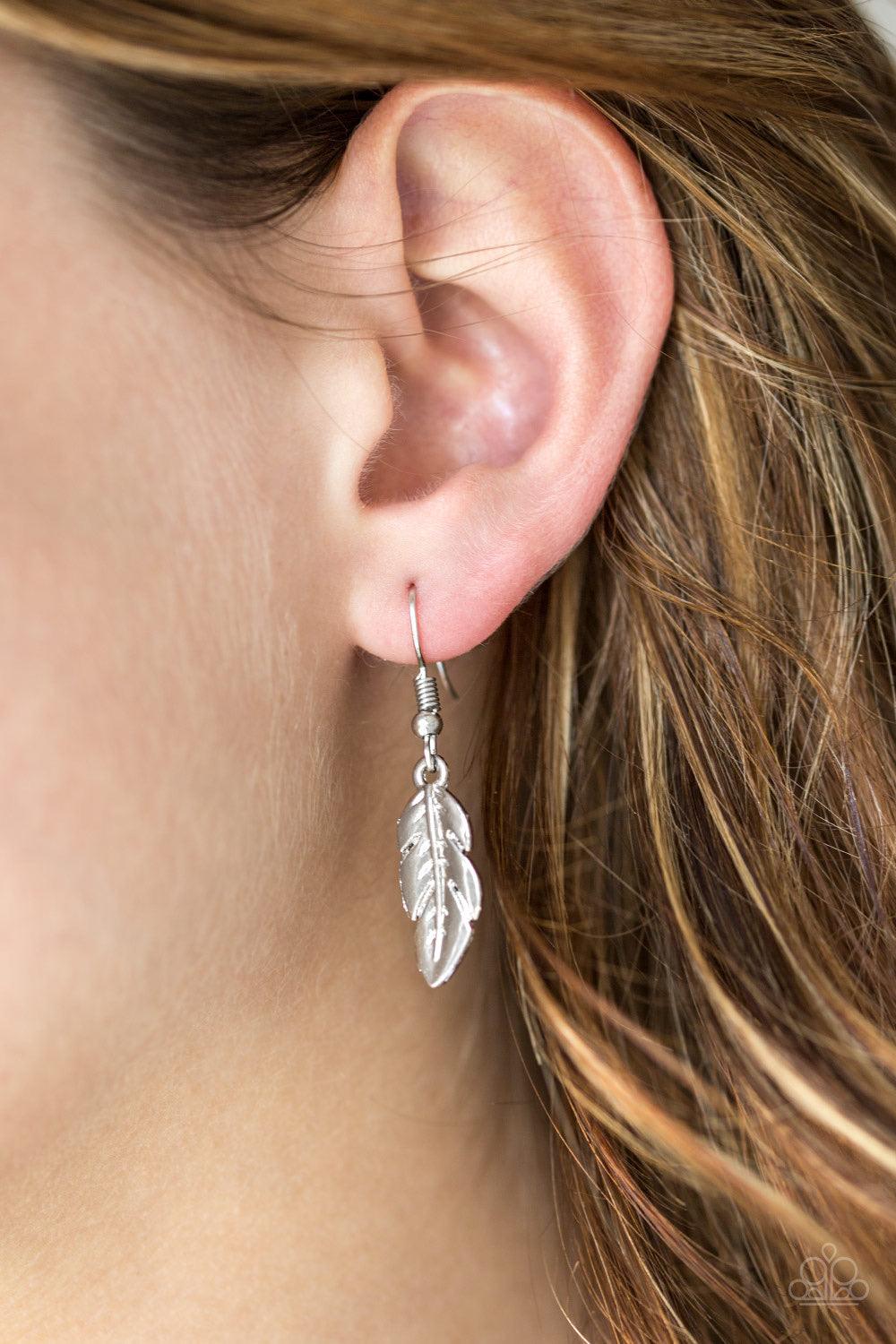 Paparazzi Accessories Rule The Roost - Green Glistening silver and greenfeathers swing from the bottom of a bold silver chain, creating a fierce fringe below the collar. Features an adjustable clasp closure. Sold as one individual Jewelry