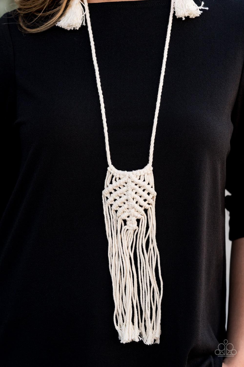 Paparazzi Accessories Macrame Mantra - White Soft twine-like cording decoratively knots into a macramé inspired pendant at the bottom of lengthened strands of twisted cording. Featuring frayed ends, excess cording streams from the bottom of the knotted ce