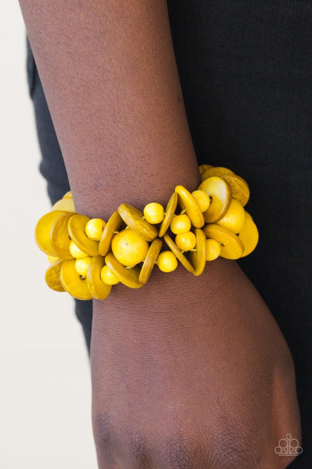 Paparazzi Accessories Tropical Temptress - Yellow Vivacious yellow wooden accents are threaded along elastic stretchy bands, creating a seasonal look around the wrist. Jewelry