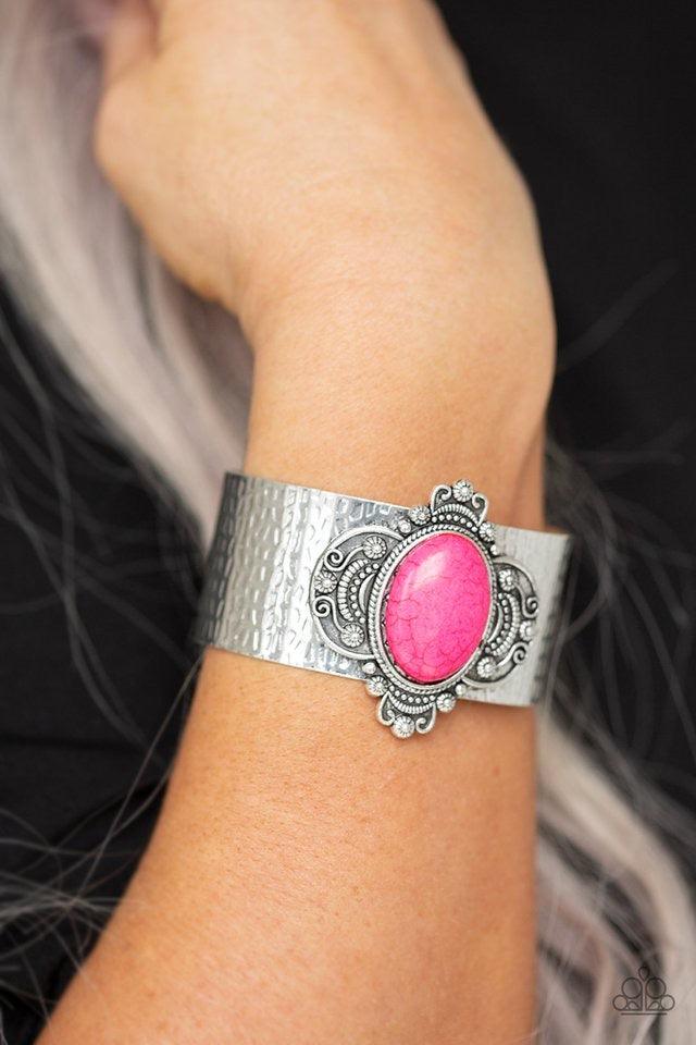 Paparazzi Accessories Yes I CANYON ~Pink Featuring a vivacious pink stone center, an ornate silver frame adorns the center of a hammered silver cuff for an artisan inspired look. Sold as one individual bracelet.