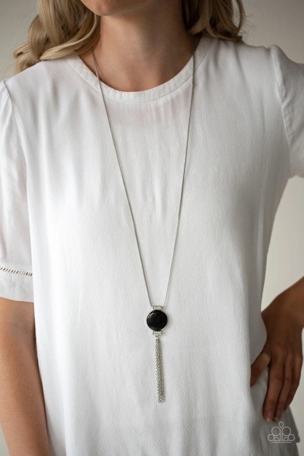 Paparazzi Accessories Happy As Can BEAM - Black Infused with white rhinestone encrusted fittings, a glowing black cat's eye pendant swings from the bottom of a rounded silver mesh chain for a whimsical look. Features an adjustable clasp closure. Sold as o