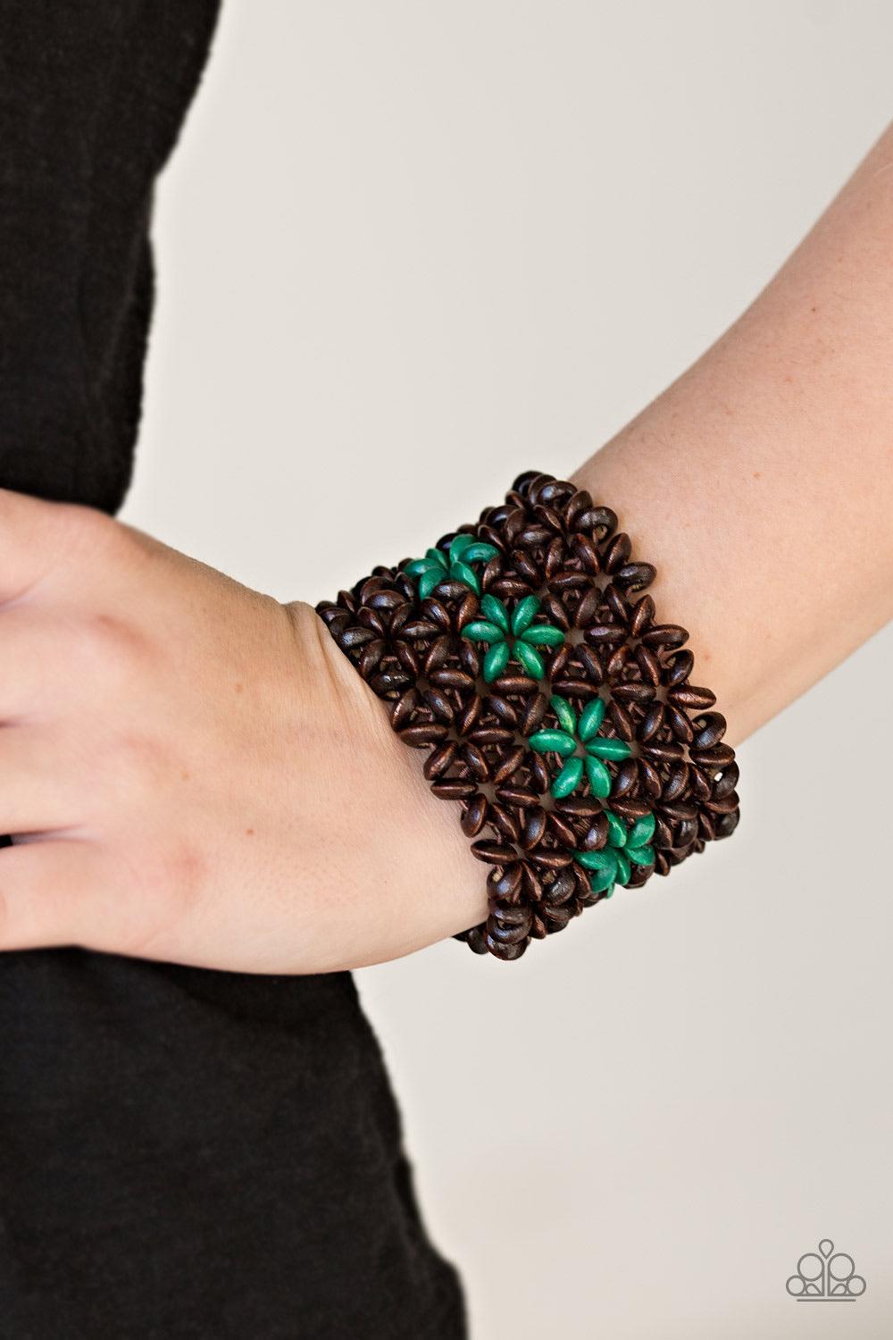 Paparazzi Accessories Bahama Babe - Green Earthy wooden accents are threaded along elastic stretchy bands, creating an ornate bracelet. Tinted in a vivacious finish, green wooden beads gather down the center, creating summery floral accents for a colorful