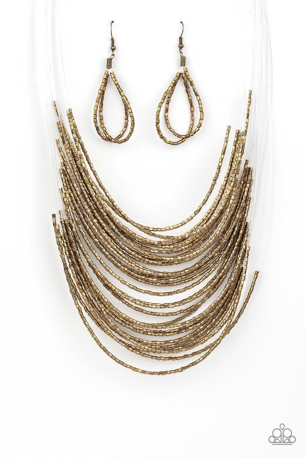Paparazzi Accessories Catwalk Queen - Brass Strand after strand of shimmering brass seed beads fall together to create a bold statement piece. Features an adjustable clasp closure. Sold as one individual necklace. Includes one pair of matching earrings. J