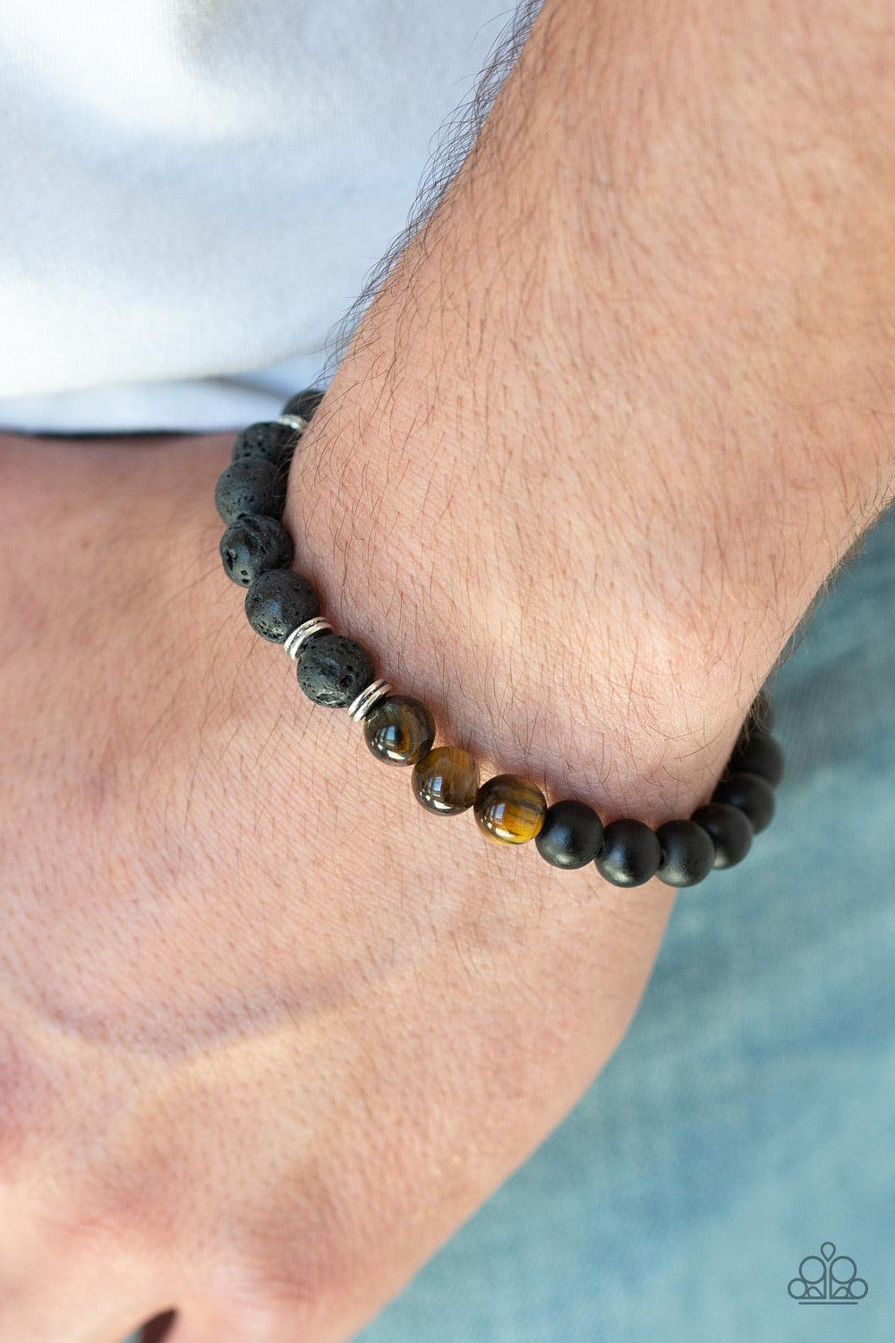 Paparazzi Accessories Karma - Brown Infused with dainty silver accents, a collection of black lava rock, earthy tiger's eye stones, and smooth black stone beads are threaded along a stretchy band around the wrist for a seasonal style. Jewelry