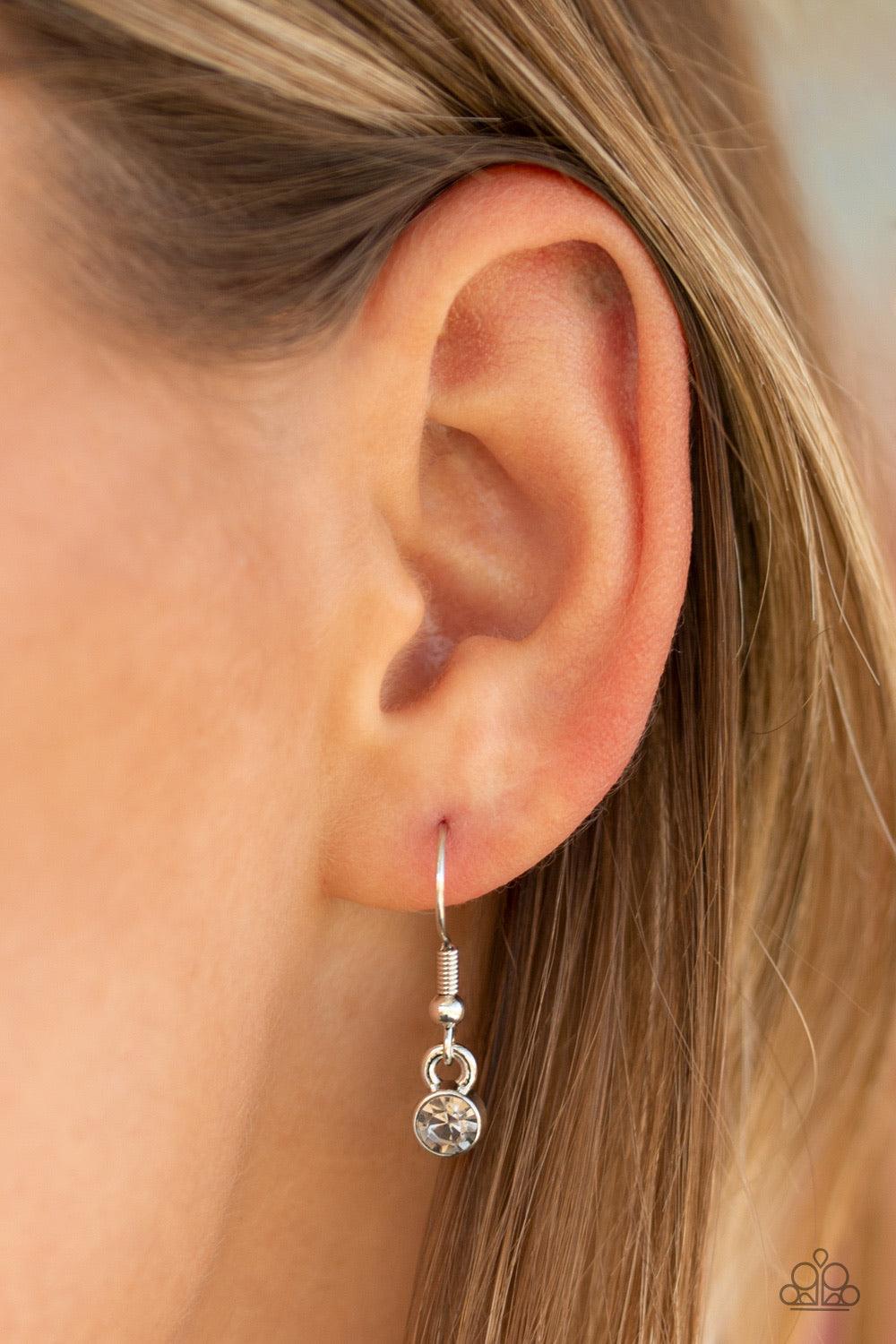 Paparazzi Accessories Flirtatiously Flashy - Silver Set atop a sleek silver fitting, a smoky heart-shaped gem swings from the bottom of a classic silver chain below the collar for a whimsical look. Features an adjustable clasp closure. Jewelry