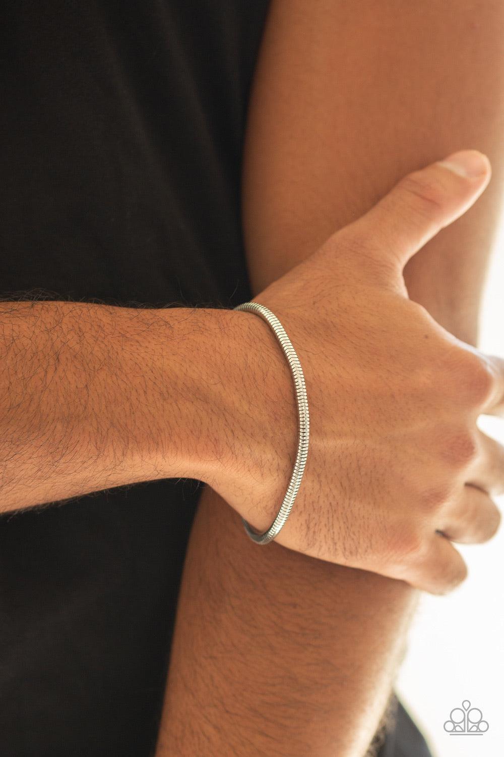 Paparazzi Accessories Winning - Silver Brushed in a high-sheen shimmer, a rounded silver snake chain links around the wrist for a sleek look. Features an adjustable clasp closure. Jewelry
