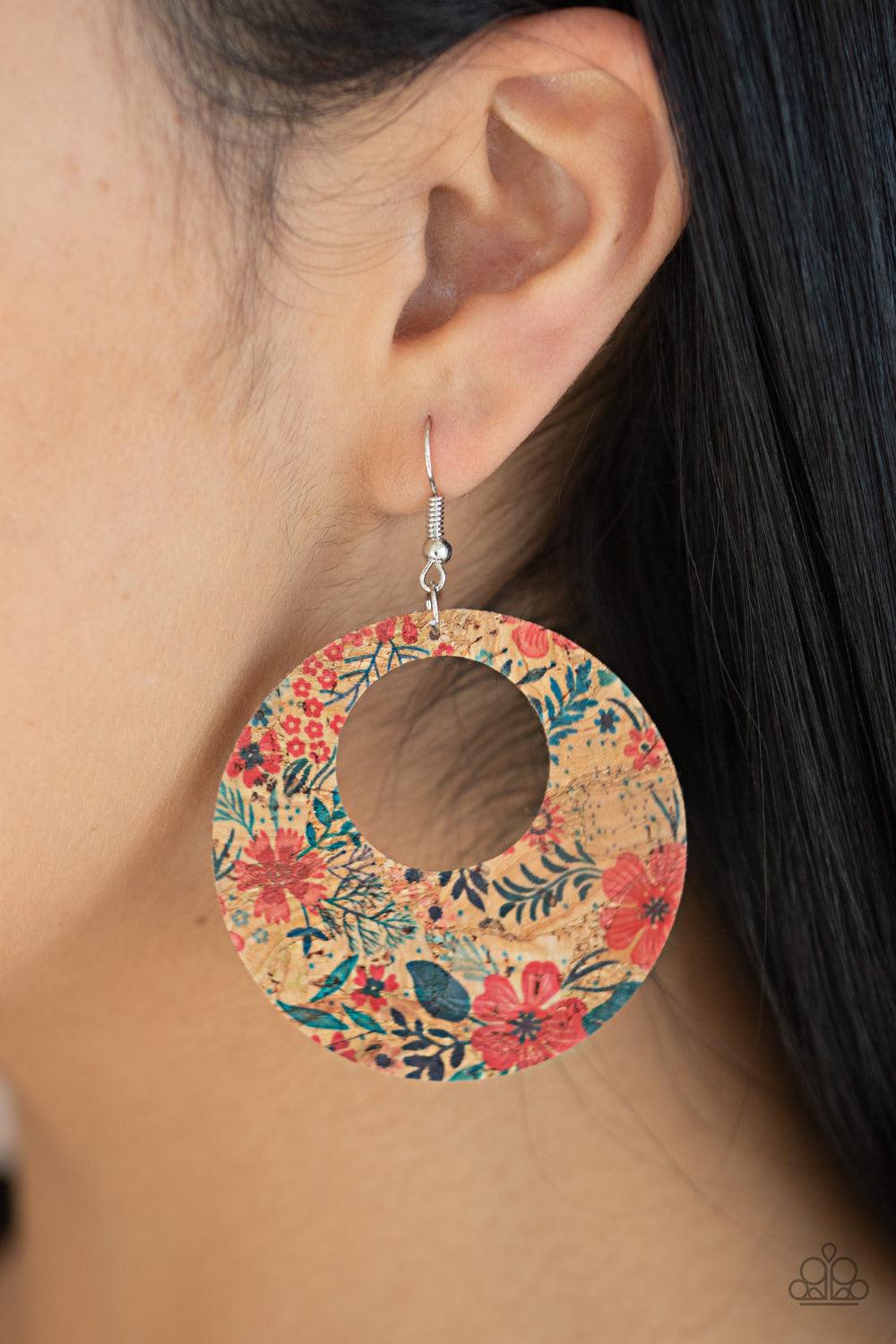 Paparazzi Accessories Put A Cork In It - Red Painted in a colorful floral print, a cork-like hoop swings from the ear in a seasonal fashion. Earring attaches to a standard fishhook fitting. Jewelry