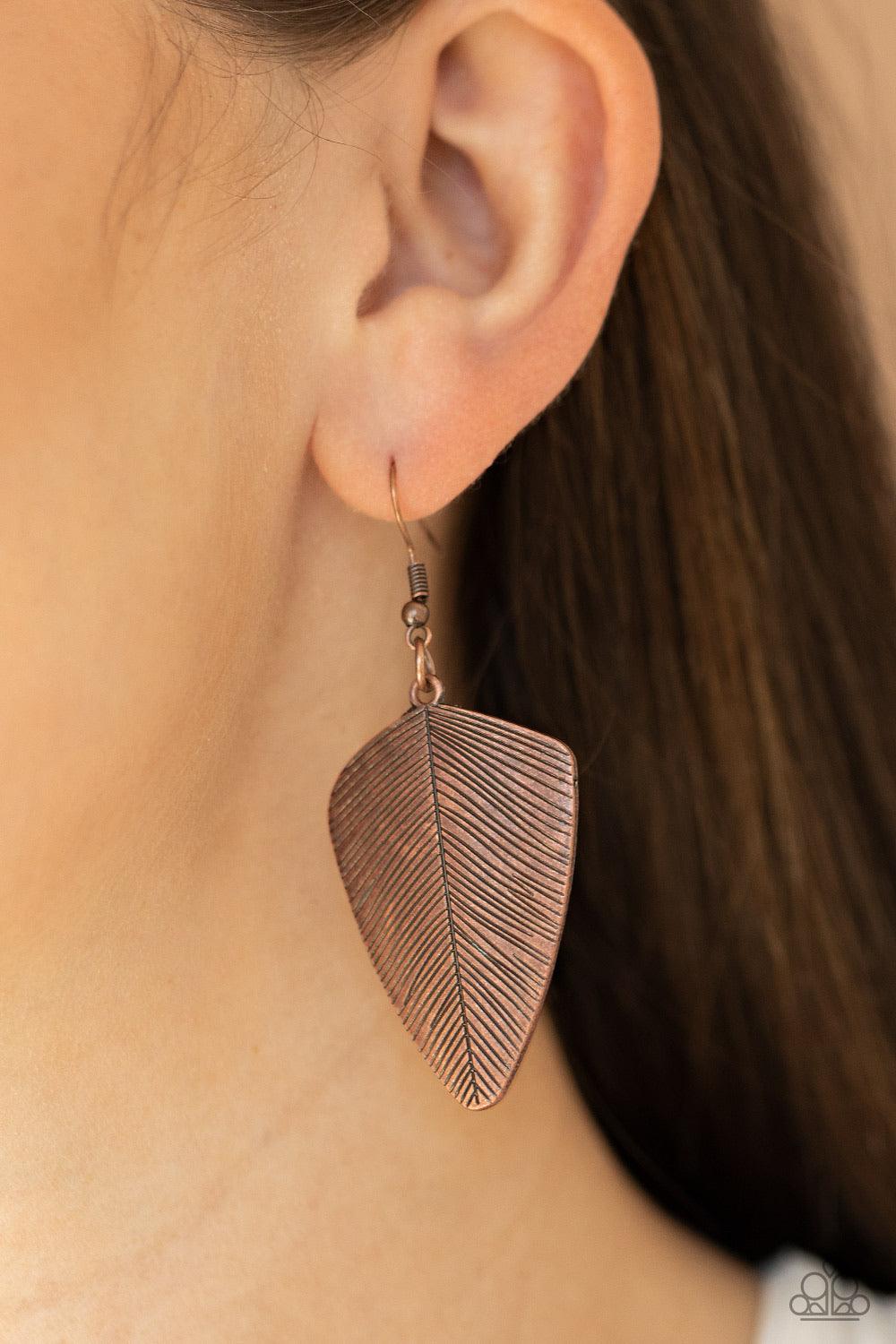 Paparazzi Accessories One of the Flock - Copper Stamped in antiqued details, a dainty copper feather delicately swings from the ear for a rustic look. Earring attaches to a standard fishhook fitting. Sold as one pair of earrings. Jewelry
