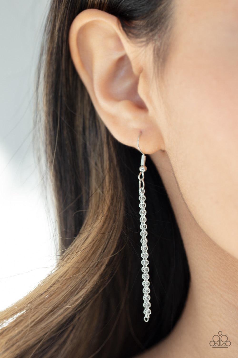 Paparazzi Accessories Tranquility Trend - Green Threaded through a rod, an earthy green stone sits inside a rectangular silver fitting, giving way to a shimmery silver chain tassel for a tranquil finish. Features an adjustable clasp closure. Jewelry