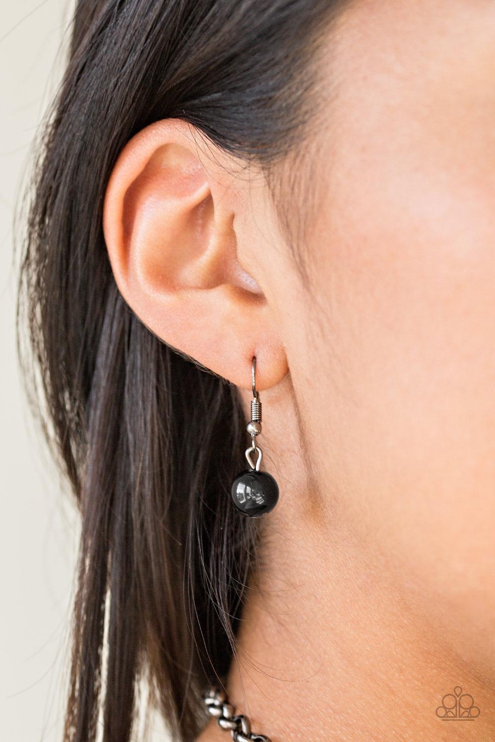 Paparazzi Accessories Color Me CEO - Black Dusted in glitter, sparkling gunmetal and shiny black beads are threaded along an invisible wire below the collar for a glamorous look. Features an adjustable clasp closure. Sold as one individual necklace. Inclu