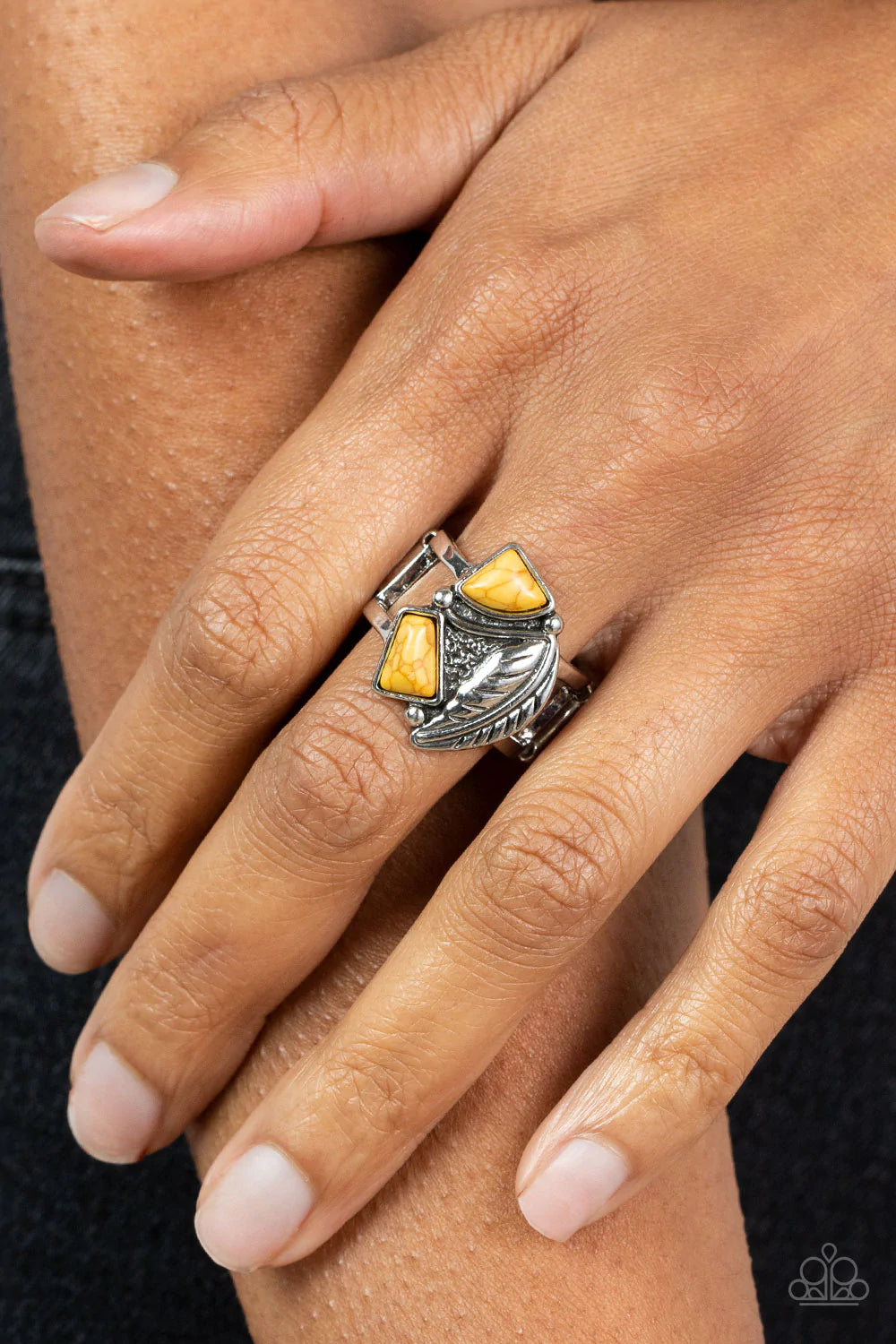 Paparazzi Accessories Make The Nest Of It - Yellow Asymmetrical yellow stones adorn the front of an antiqued silver frame adorned in a silver feather, creating a rustic centerpiece atop the finger. Features a stretchy band for a flexible fit. Sold as one
