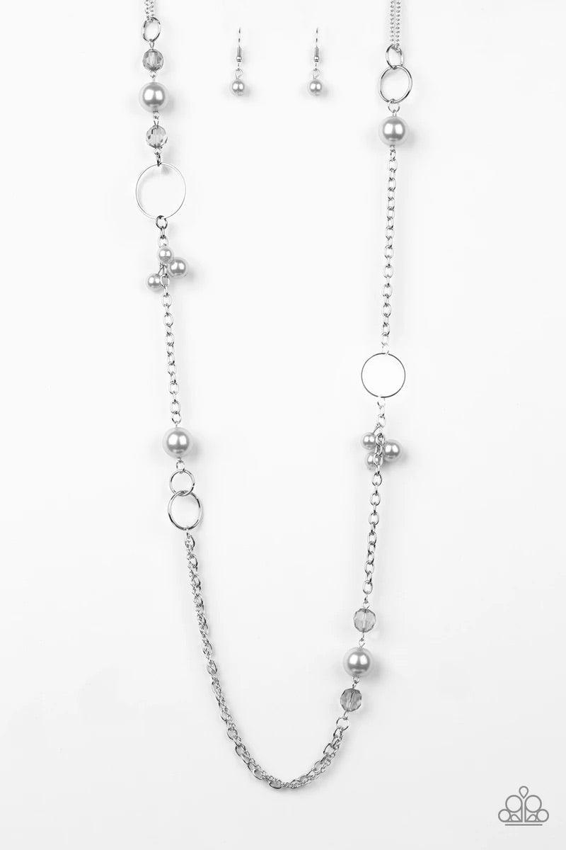 Paparazzi Accessories Pageant Princess - Silver A collection of glistening silver hoops, smoky beads, and pearly silver beads trickle along a shimmery silver chain for a refined look. Features an adjustable clasp closure. Sold as one individual necklace.