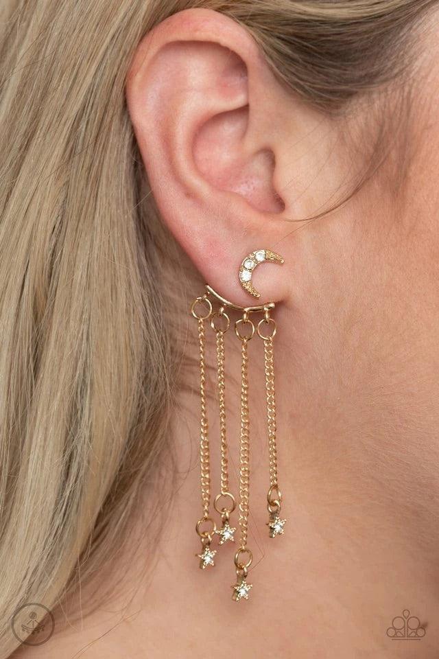 Paparazzi Accessories Cosmic Goddess - Gold Encrusted in dainty white rhinestones, a studded gold moon fitting attaches to a double-sided post designed to fasten behind the ear. Dotted in dainty white rhinestones, dainty gold stars swing from a curtain of