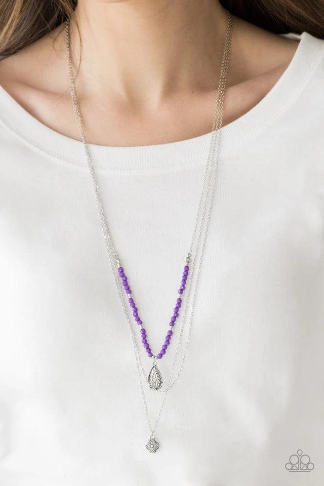 Paparazzi Accessories Mild Wild - Purple Infused with vivacious purple beading and an ornate silver teardrop pendant, a colorfully beaded strand gives way to a plain silver chain and a dainty silver chain featuring an antiqued pendant for a whimsically la