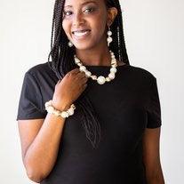 Paparazzi Accessories New York Nightlife - Gold Gradually increasing in size toward the center, dramatic white pearls and shiny gold beads drape below the collar for a refined look. Glistening gold accents are sprinkled between the classic beads, adding d