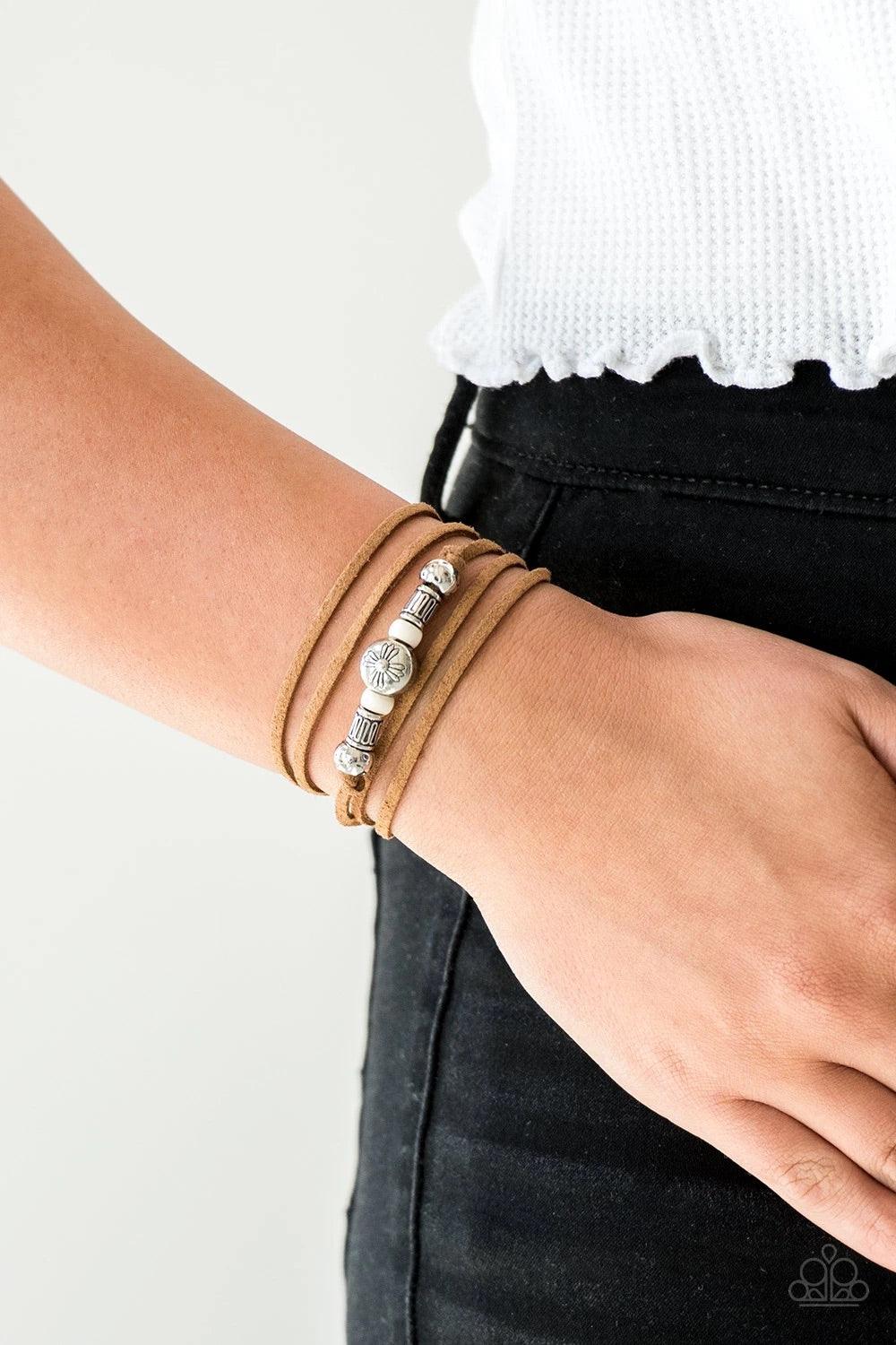 Paparazzi Accessories Find Your Way - White An array of white and silver beads are knotted in place along elongated suede cording for a wanderlust fashion. To secure bracelet, tie ends in place around the wrist at desired length. Sold as one individual br