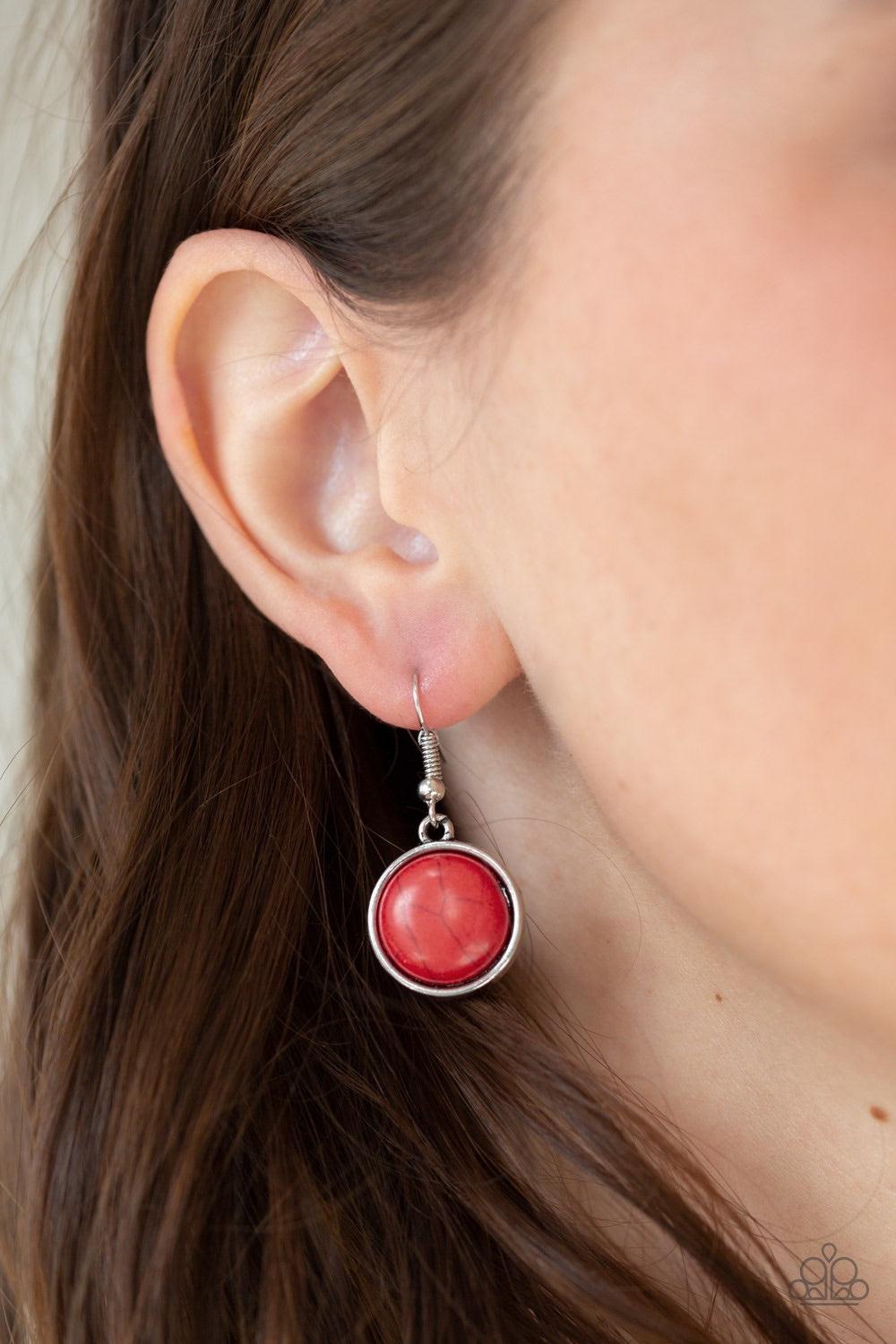 Paparazzi Accessories Cougar - Red Rippling with hammered details, flared silver frames join below the collar, creating a fierce fringe. Fiery red stones are pressed into the tops of the frames for a colorful finish. Features an adjustable clasp closure.