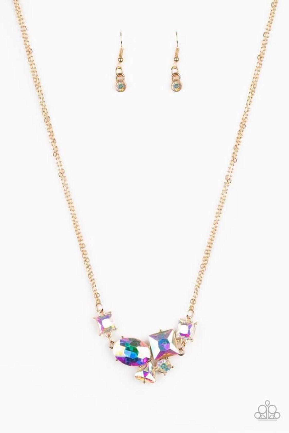 Paparazzi Accessories Constellation Collection - Multi Varying in shape and size, triangular, round, and square cut iridescent rhinestones coalesce into a floating pendant at the bottom of doubled gold chains, creating a stellar shimmer below the collar.