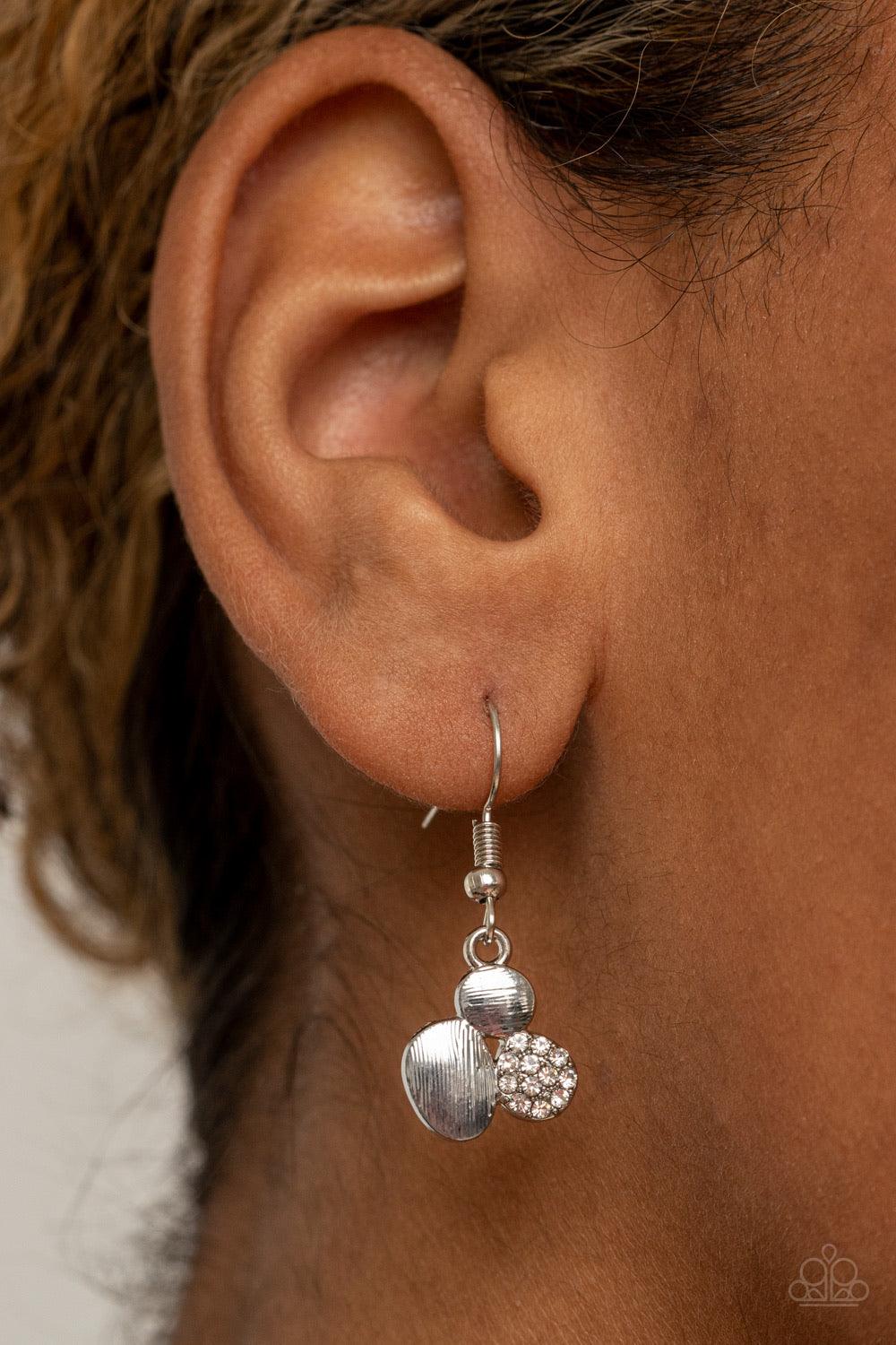 Paparazzi Accessories A Hard LUXE Story - White Featuring imperfect oval shapes, a series of delicately scratched and white rhinestone encrusted frames connect into a clustered pendant below the collar for a refined flair. Features an adjustable clasp clo