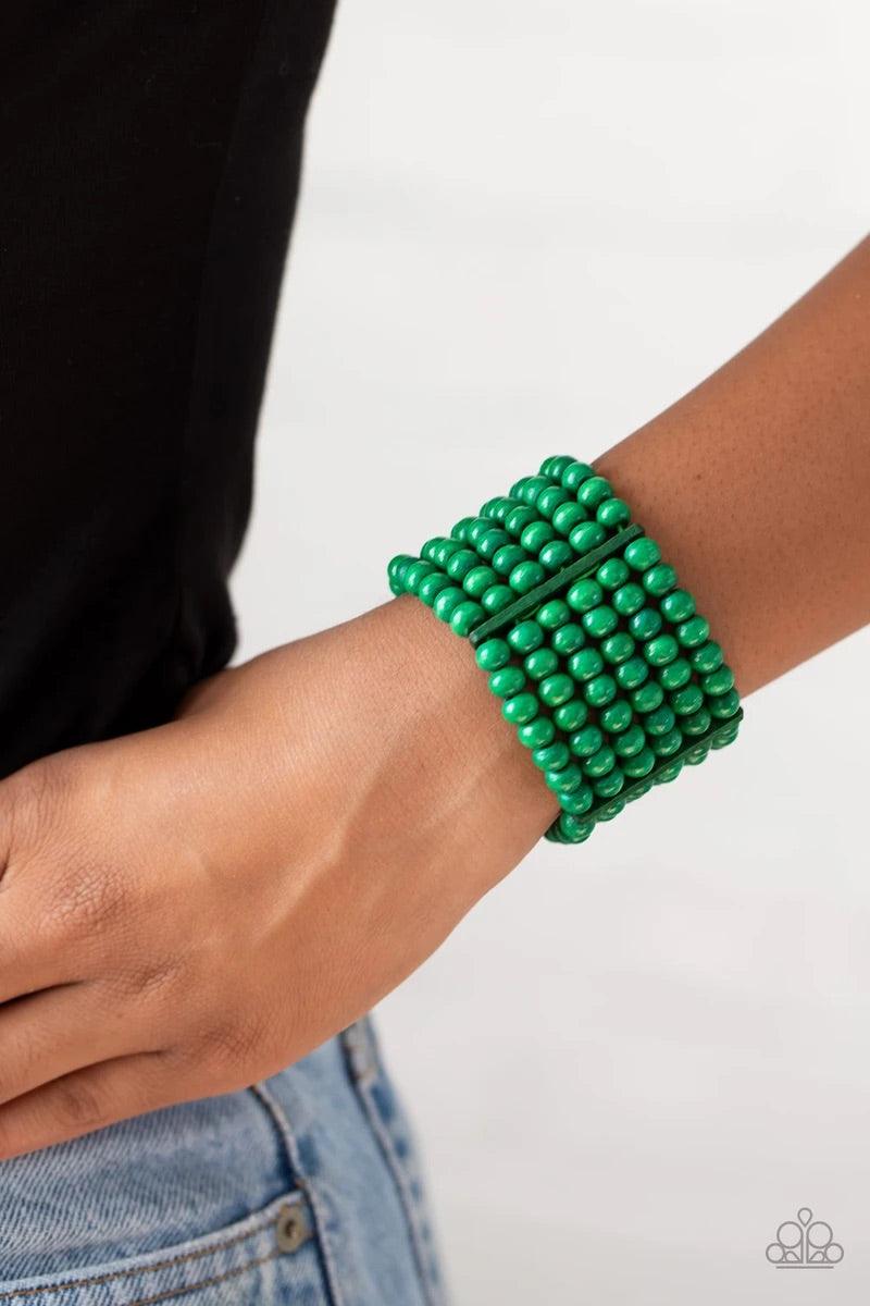 Paparazzi Accessories Tanning in Tanzania - Green Held together with rectangular wooden fittings, strands of refreshing green wooden beads are threaded along stretchy bands that layer around the wrist into one colorful stretch bracelet. Sold as one indivi