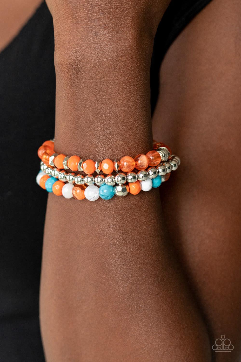 Paparazzi Accessories Sugary Shimmer - Multi Infused with shimmery silver accents, a collection of glassy and acrylic, blue, orange, and white beads are threaded along stretchy bands around the wrist, creating colorful layers. Jewelry