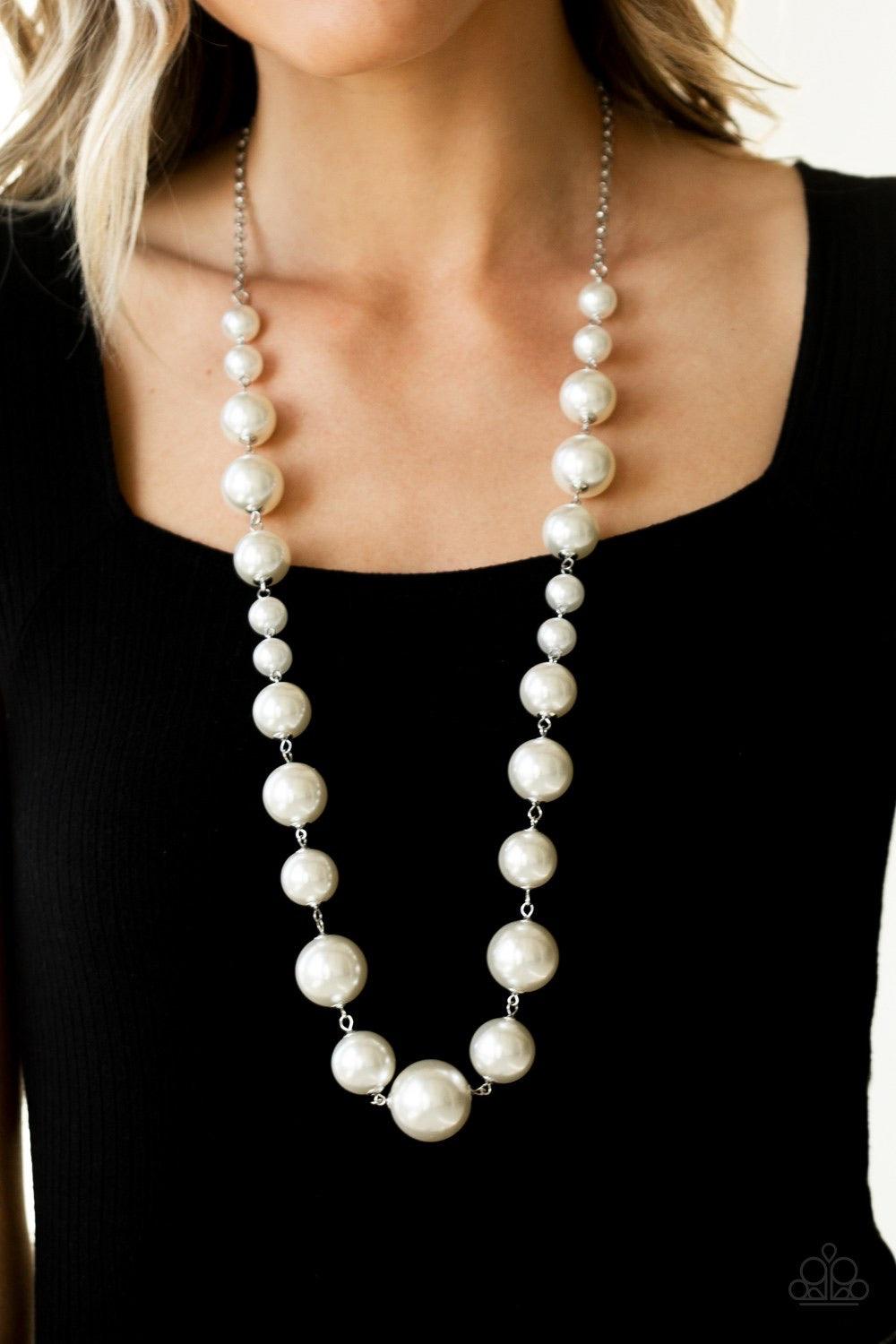 Paparazzi Accessories Pearl Prodigy - White Infused with dainty white pearls, a bubbly collection of over sized pearls link across the chest for a timeless finish. Features an adjustable clasp closure. Jewelry
