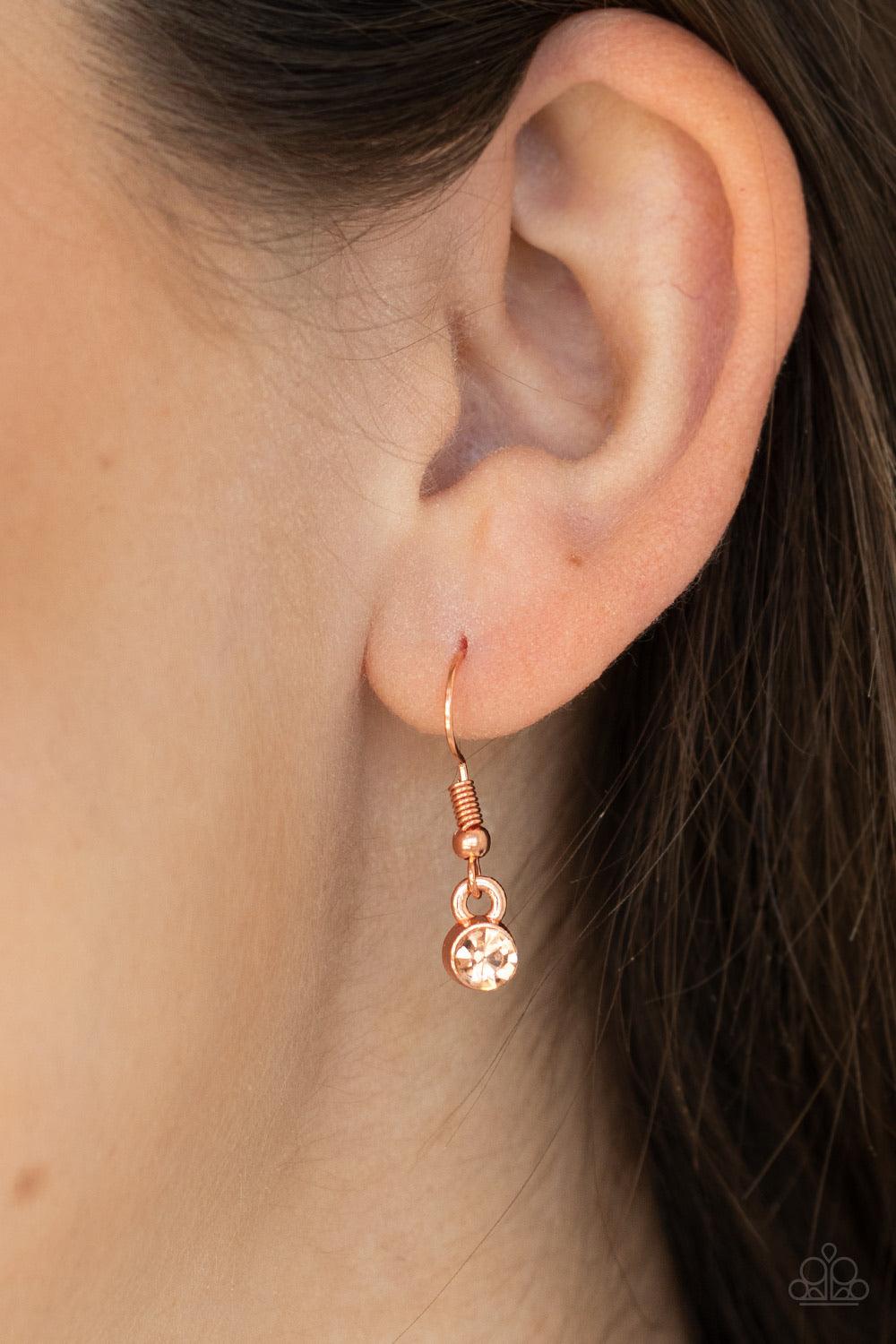 Paparazzi Accessories GLOW By Heart - Copper Encrusted in sparkly rhinestones, an airy shiny copper heart frame swings from a dainty shiny copper chain below the collar for a romantic look. Features an adjustable clasp closure. Sold as one individual neck