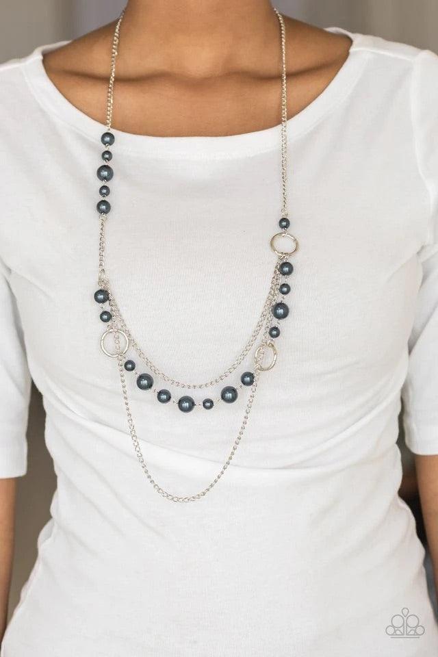 Paparazzi Accessories Party Dress Princess - Blue Pearly blue beads and shimmery silver hoops trickle along glistening silver chains, creating mismatched layers down the chest. Features an adjustable clasp closure. Jewelry