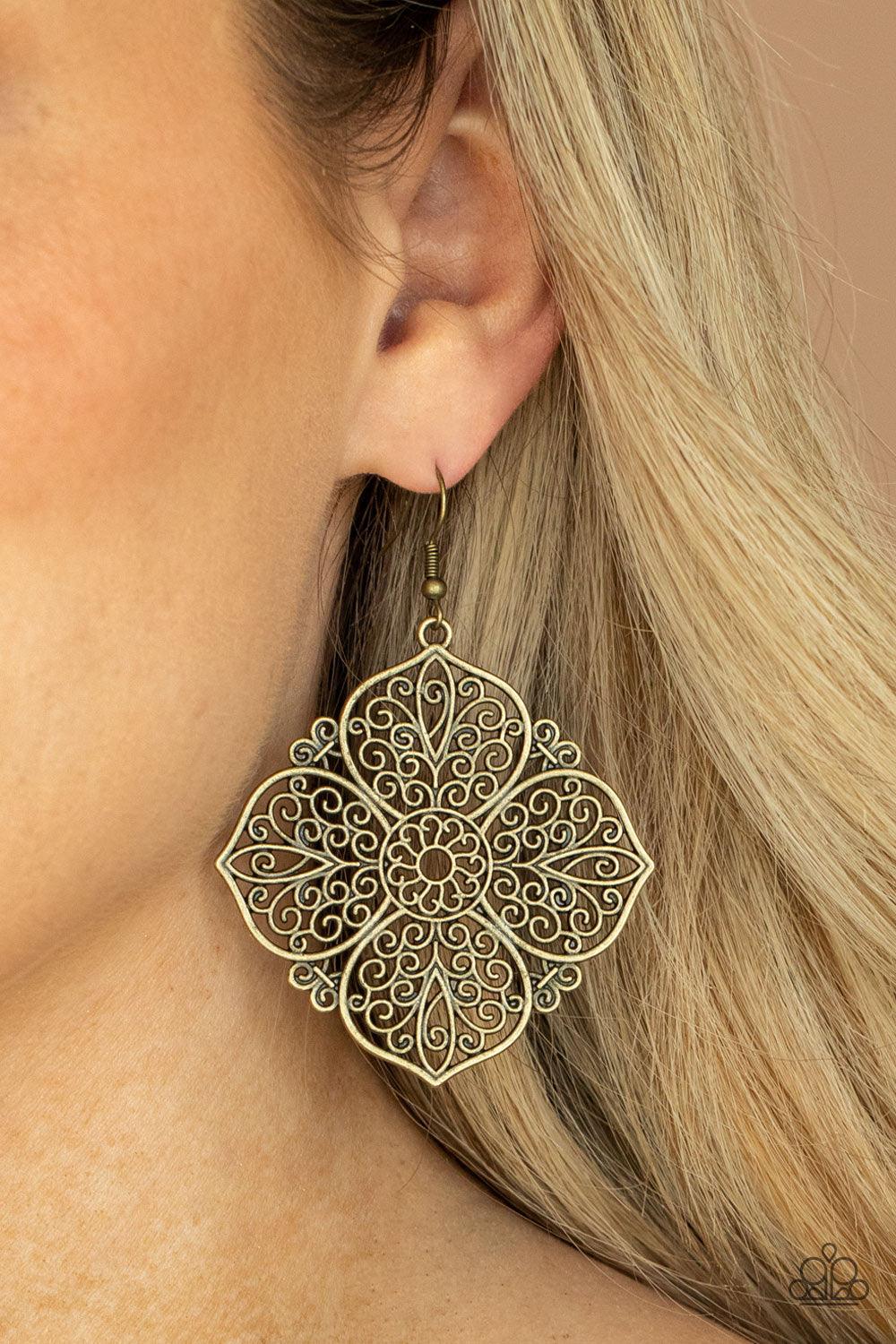 Paparazzi Accessories Dubai Detour - Brass Filled with a frilly scroll, oversized antiqued brass petals bloom into a decorative floral frame for a seasonal shimmer. Earring attaches to a standard fishhook fitting. Sold as one pair of earrings. Jewelry