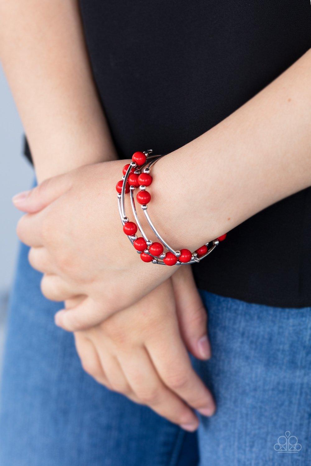 Paparazzi Accessories Let Freedom Ring - Red Dainty silver beads, silver cylindrical accents, and fiery red beads are threaded along a coiled wire, creating a colorful infinity wrap style bracelet around the wrist. Sold as one individual bracelet. Jewelry