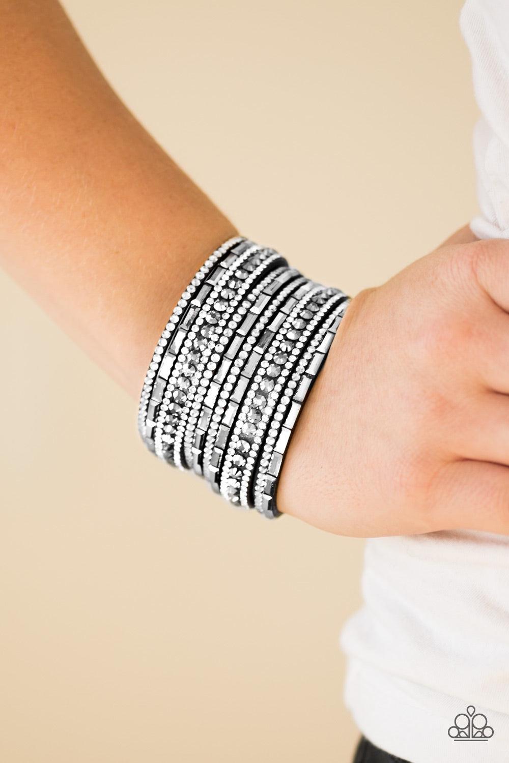 Paparazzi Accessories Wham Bam Glam - Black/White Varying in size and shape, glassy white rhinestones are encrusted along strands of black suede for a sassy look. Features an adjustable snap closure. Jewelry