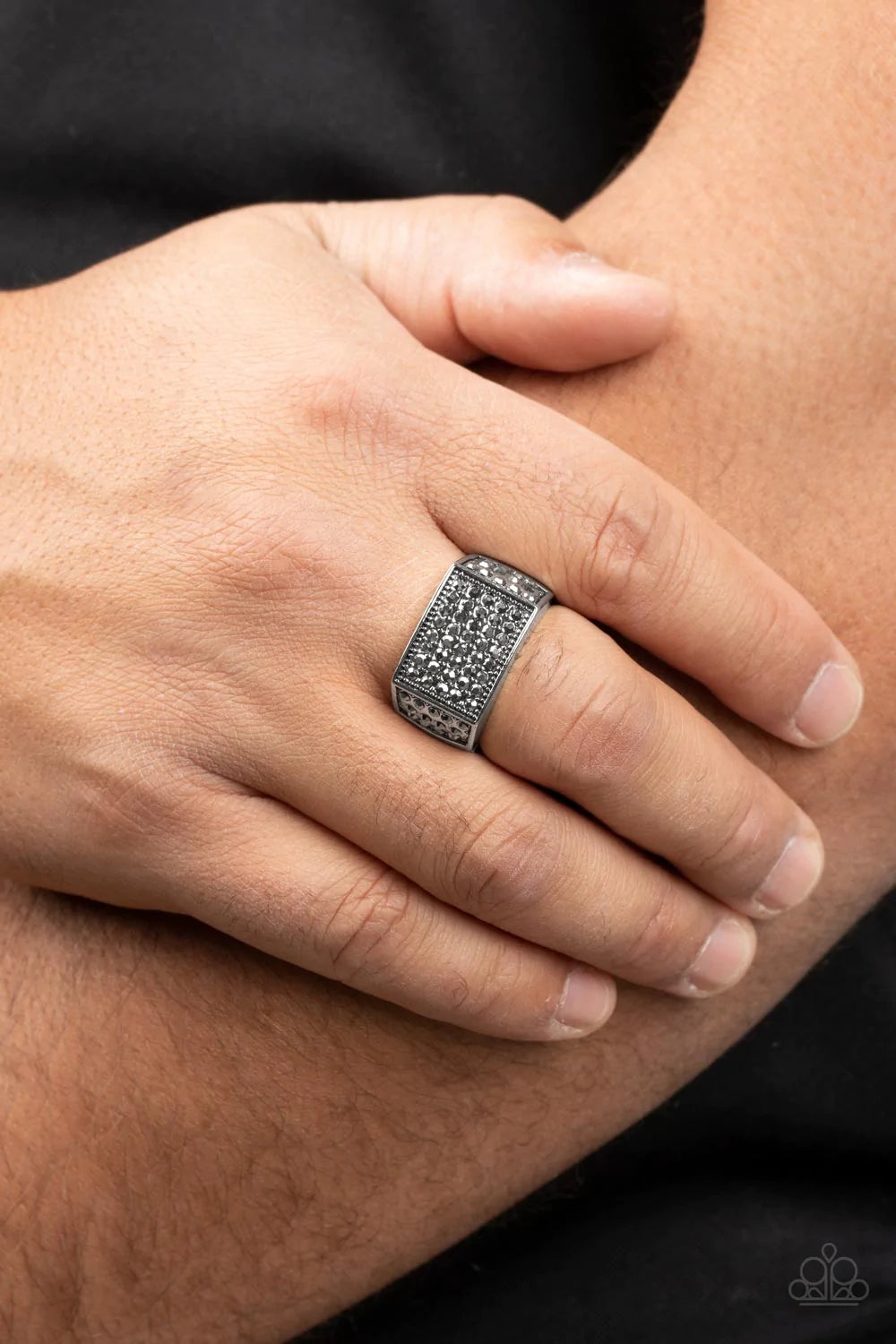 Paparazzi Accessories Metro Merger - Silver The front of a rectangular silver frame is encrusted in sections of hematite rhinestones, resulting in a smoldering centerpiece atop the finger. Features a stretchy band for a flexible fit. Sold as one individua