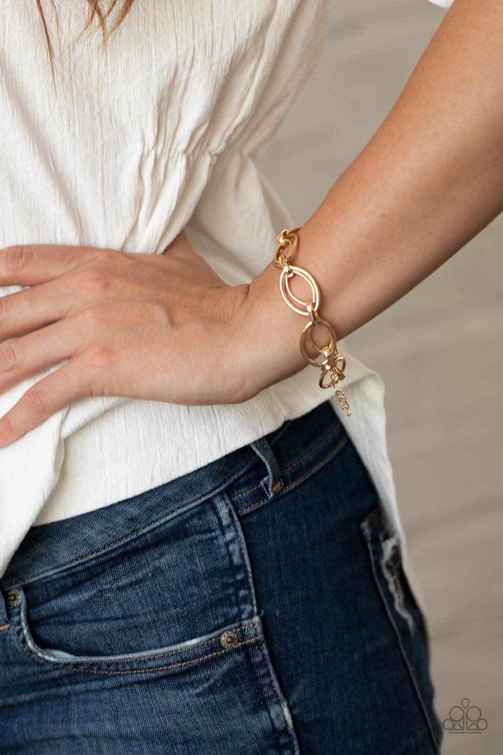 Paparazzi Accessories Simplistic Shimmer - Gold Smooth and hammered gold oval-like links delicately connect across the wrist for an edgy, industrial display. Features an adjustable clasp closure. Sold as one individual bracelet. Jewelry