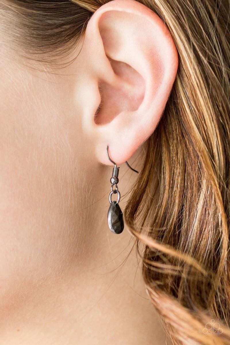 Paparazzi Accessories Bravo Bravado - Black Mismatched gunmetal chains layer down the chest. Faceted gunmetal teardrops and shiny gunmetal accents swing from two of the shimmery gunmetal chains for an edgy finish. Features an adjustable clasp closure. Sol