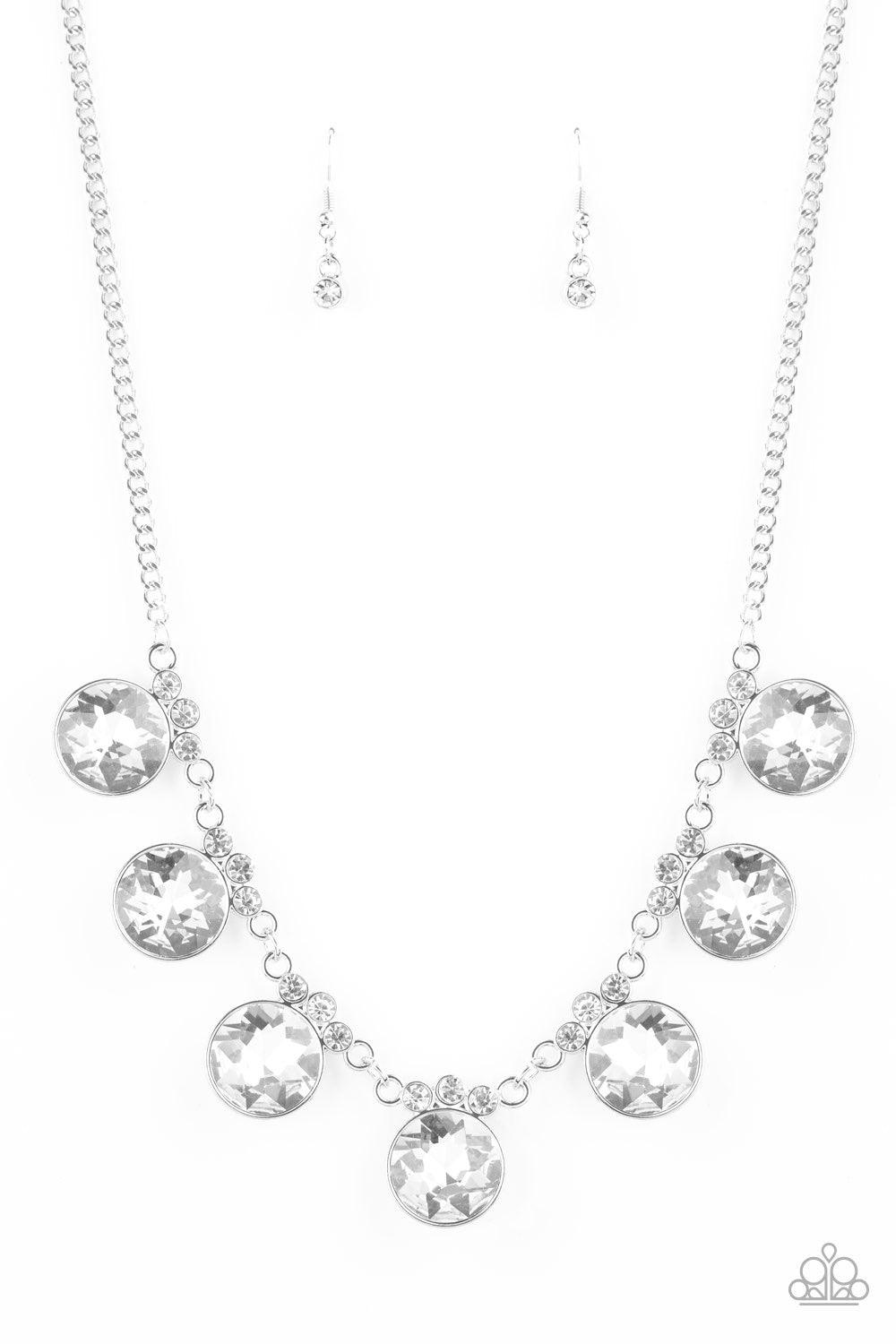 Paparazzi Accessories GLOW-Getter Glamour - White Crowned in a trio of dainty white rhinestones, an exaggerated display of oversized white gems delicately links below the collar for a glamorous glow. Features an adjustable clasp closure. Jewelry