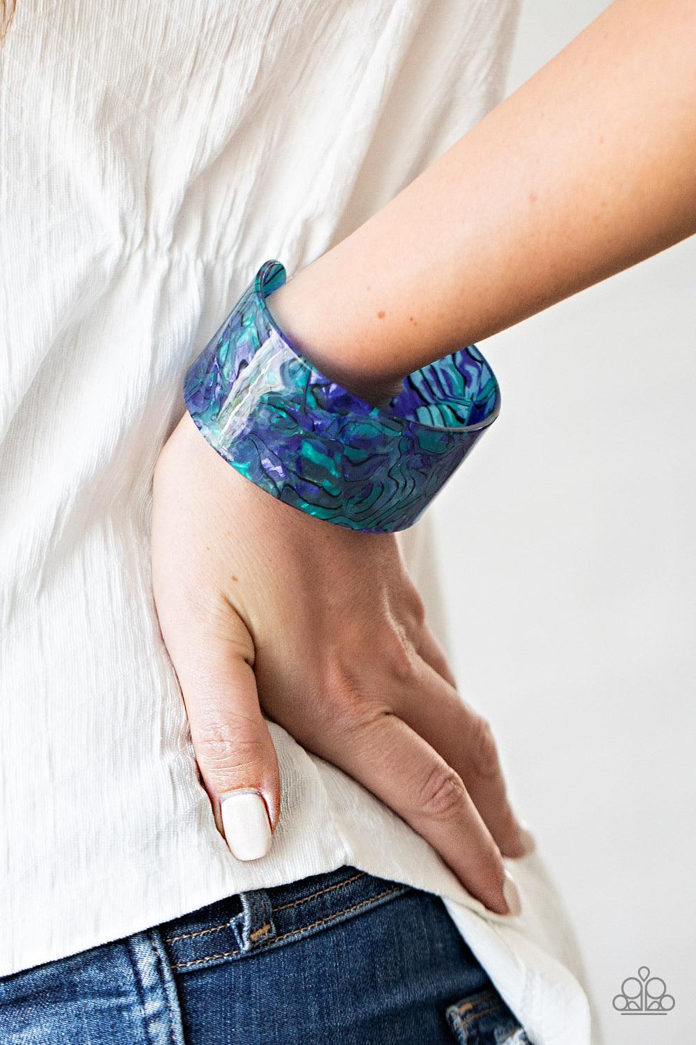 Paparazzi Accessories Cosmic Couture - Blue Featuring a retro watercolor pattern, a thick blue acrylic cuff curls around the wrist for an out-of-this-world colorful look. Sold as one individual bracelet. Jewelry