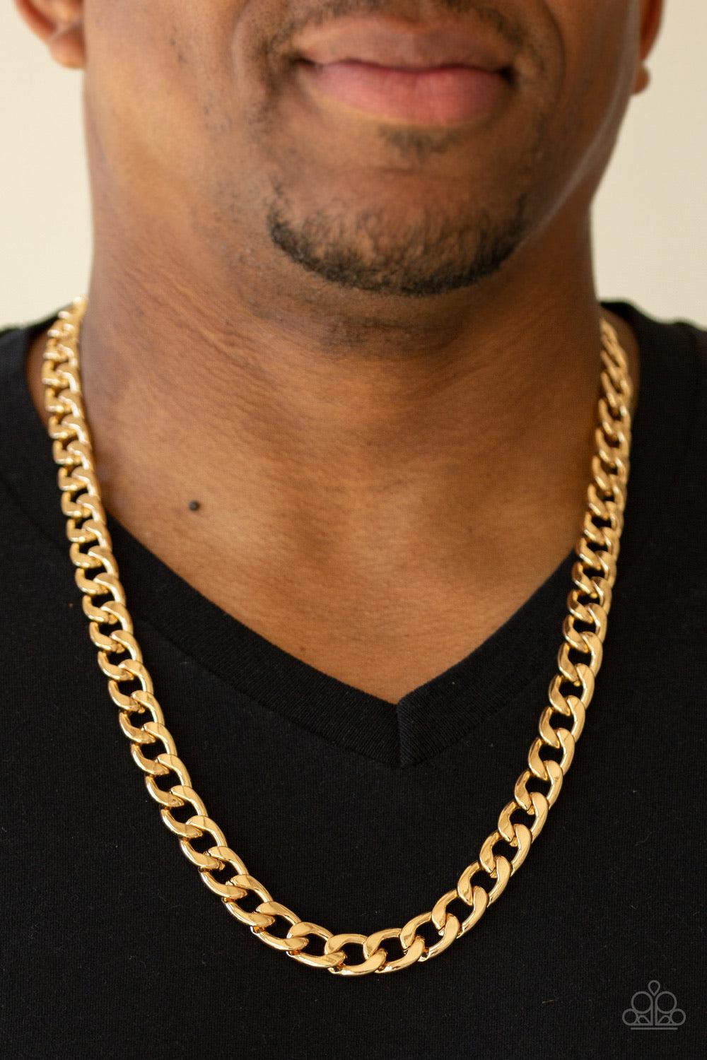 Paparazzi Accessories The Underdog - Gold Brushed in a high-sheen gold finish, a strand of oval curb chain dramatically drapes across the chest for a bold industrial look. Features an adjustable clasp closure. Jewelry