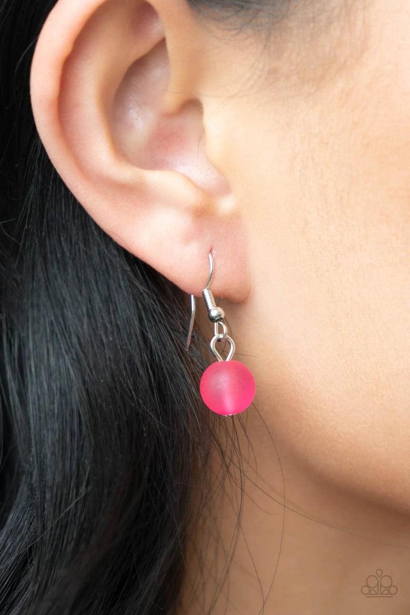 Paparazzi Accessories Melrose Melody - Pink A series of opaque and cloudy faceted Raspberry Sorbet beads are threaded along an invisible wire. Dainty silver beads add shining accents as they traverse across the collar on a silver chain in a brightly melod