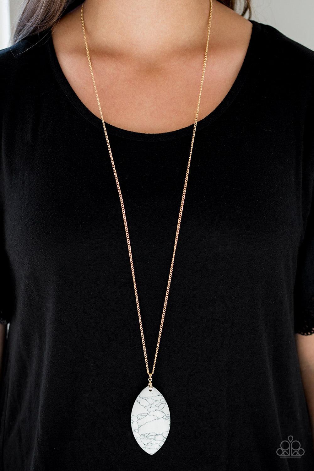 Paparazzi Accessories Santa Fe Simplicity - White Chiseled into a tranquil almond-shape, an oversized white stone pendant swings from the bottom of a lengthened gold chain in a seasonal fashion. Features an adjustable clasp closure. Jewelry