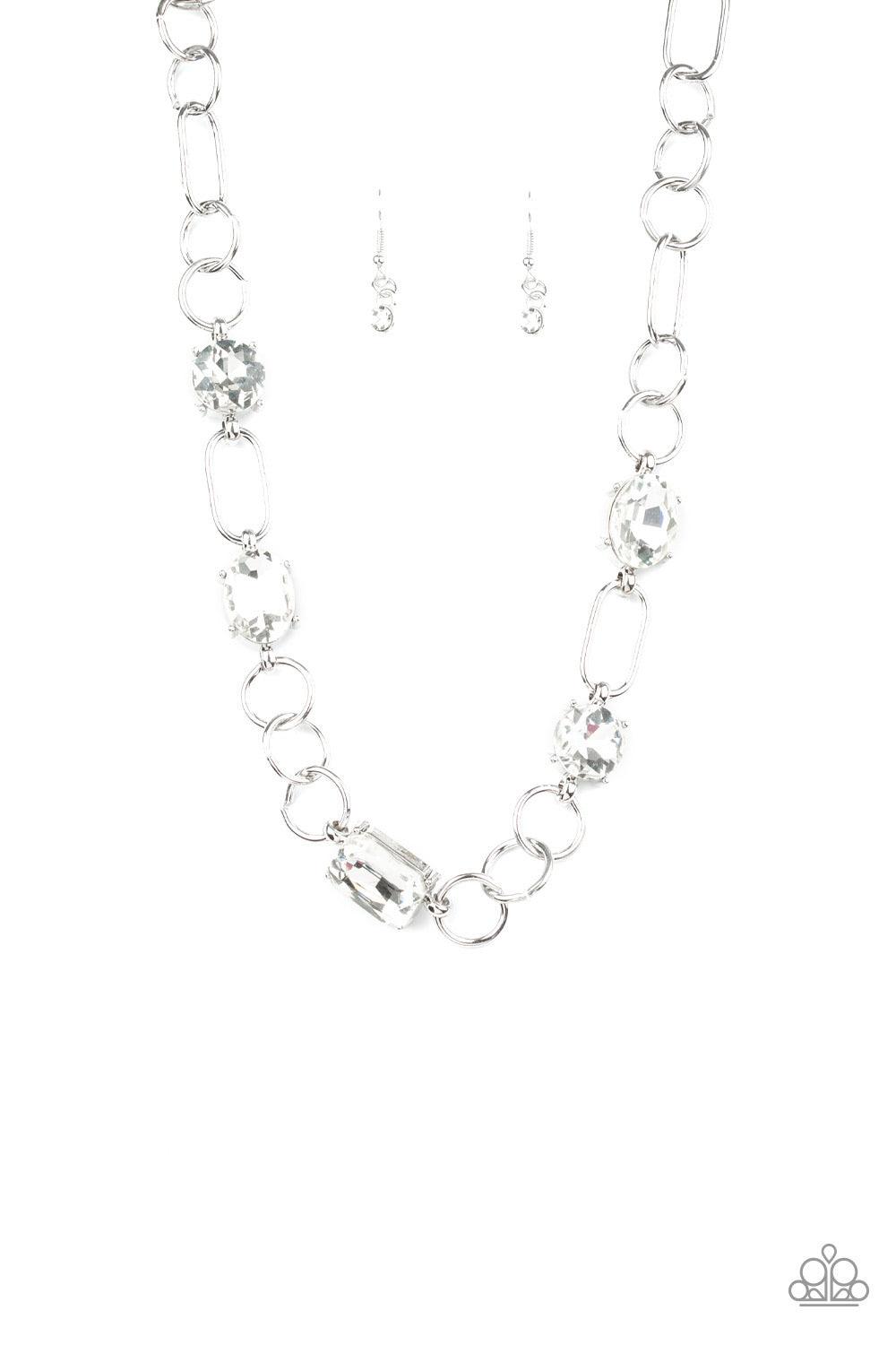 Paparazzi Accessories Urban District - White Featuring round, oval, and emerald style cuts, glittery white rhinestone fittings link with mismatched silver rings below the collar for an edgy glamorous look. Features an adjustable clasp closure. Sold as one
