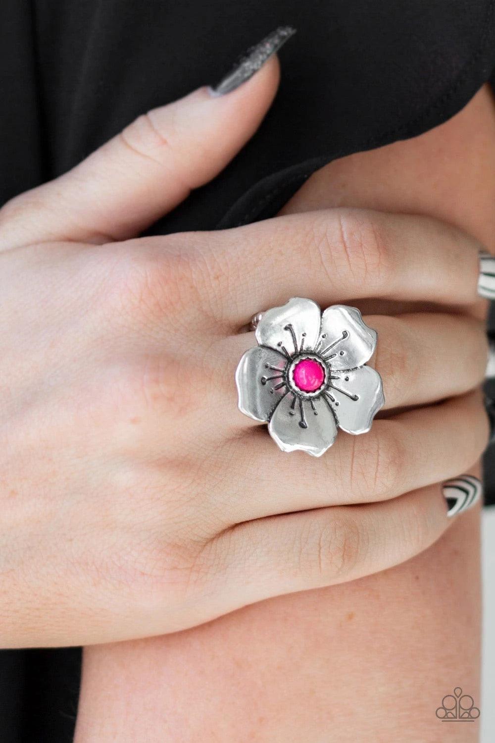 Paparazzi Accessories Boho Blossom - Pink A bright pink bead is pressed into the center of a blooming silver flower radiating with antiqued details for a whimsical look. Features a stretchy band for a flexible fit.Sold as one individual ring. Jewelry
