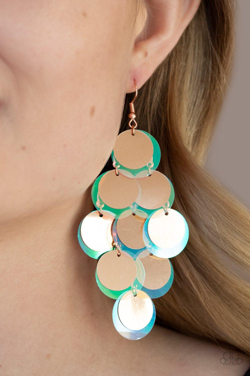 Paparazzi Accessories Sequin Seeker - Copper A bubbly collection of oversized shiny copper and iridescent sequins cascade from the ear, creating a flirty holographic fringe. Earring attaches to a standard fishhook fitting. Sold as one pair of earrings. Je
