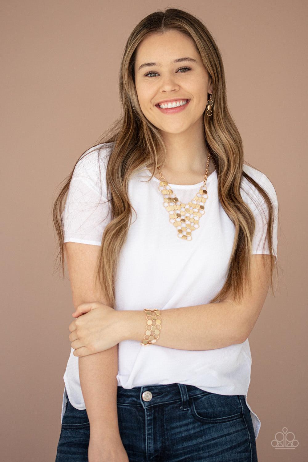 Paparazzi Accessories Cast A Wider Net - Gold Dotted with reflective gold discs, an interlocking net of textured gold rings link into edgy netted layers around the wrist. Features an adjustable clasp closure. Jewelry